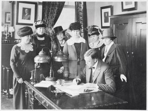 Governor Carl Elias Milliken Signing the Suffrage Bill as Six Women Look On by American Photographer